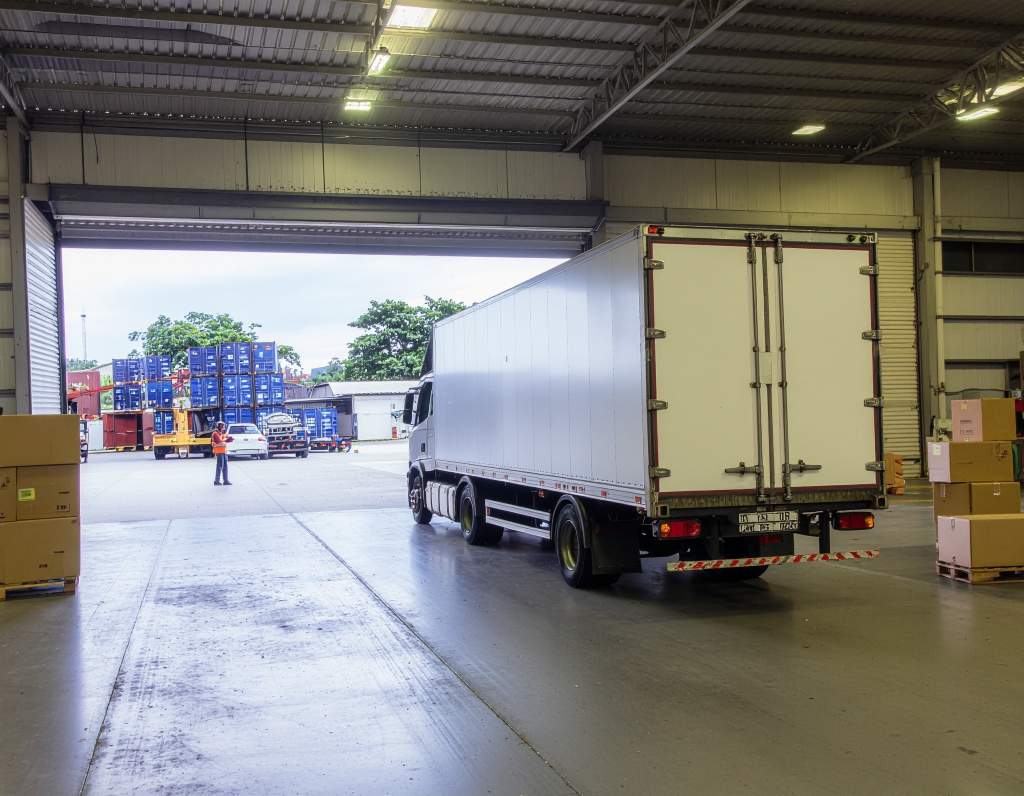 Truck transporting customer goods at warehouse under transporter / carrier liability insurance in Malaysia